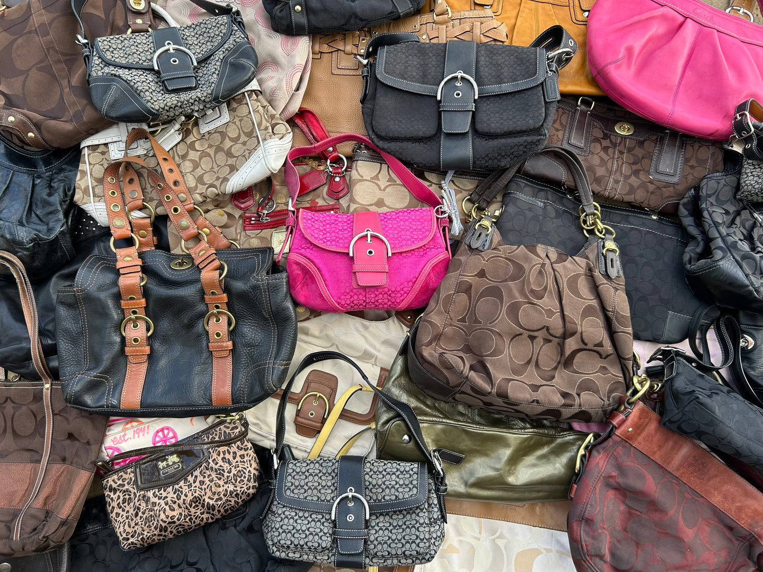 Collection of various handbags in different colors and styles.